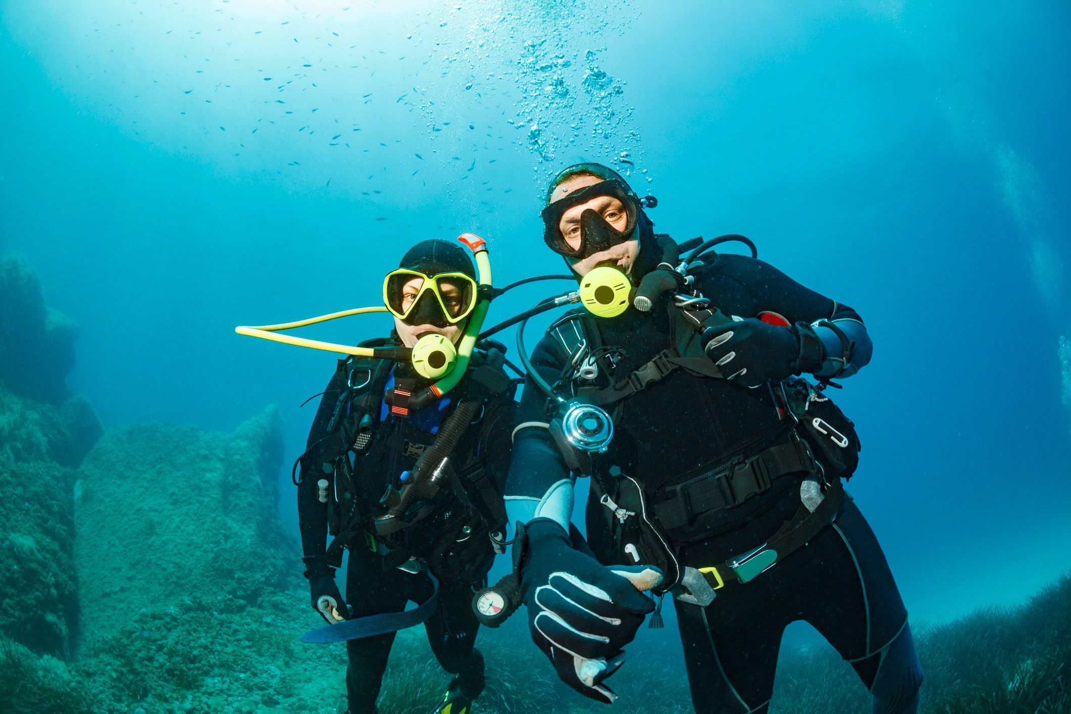 Starr and Paul scuba diving underwater