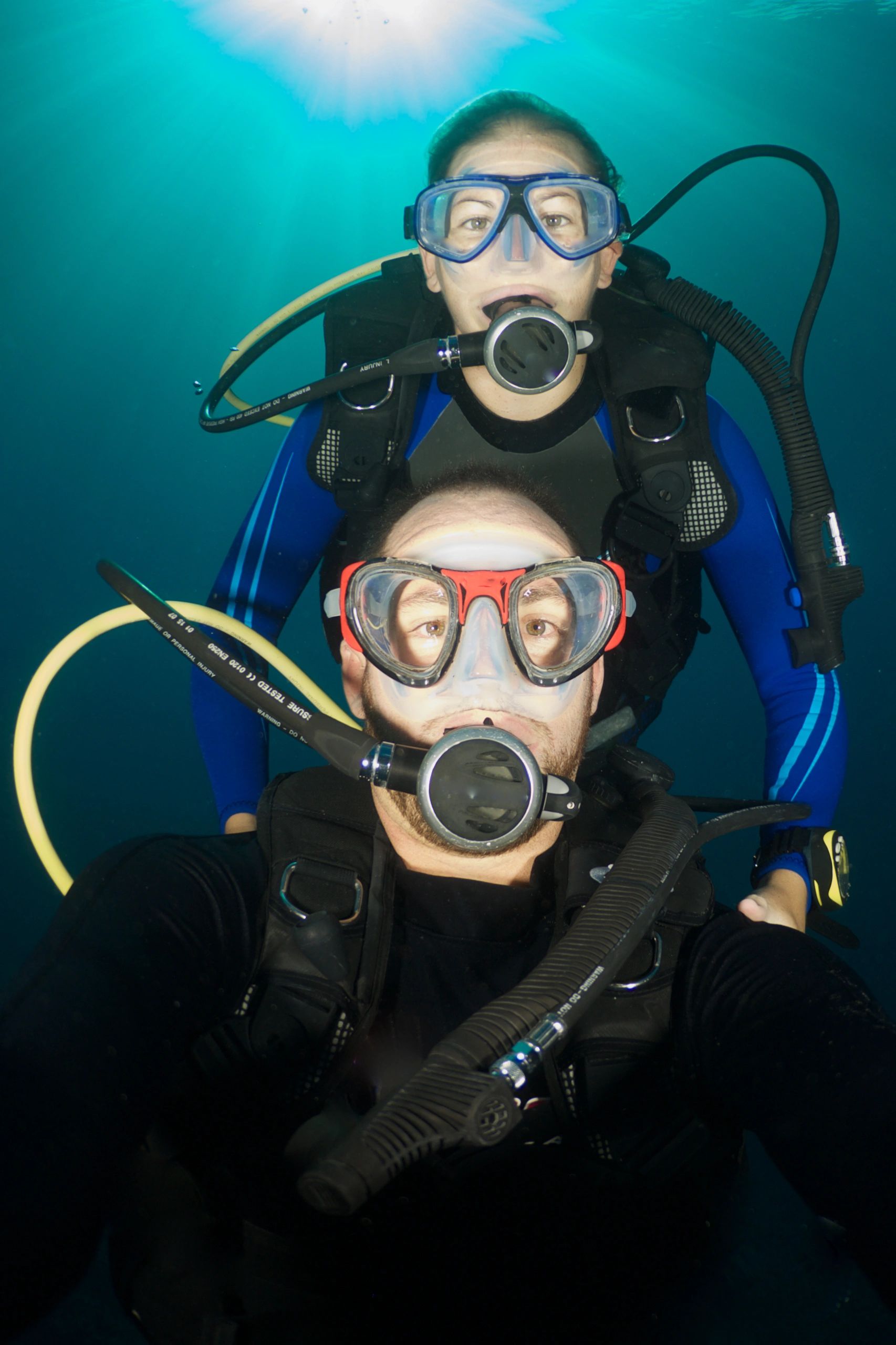Family scuba diving underwater